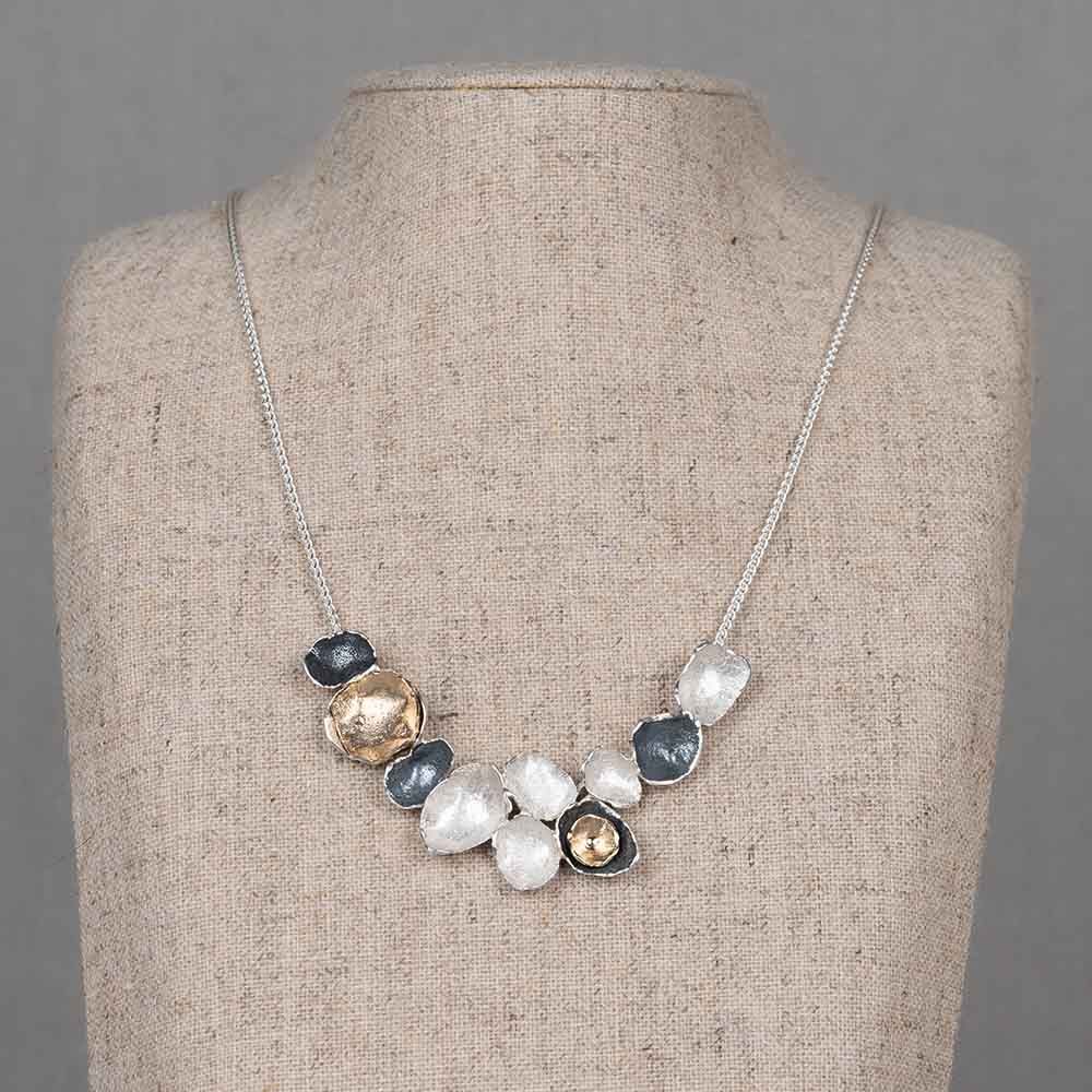 Collier met boog van schakels