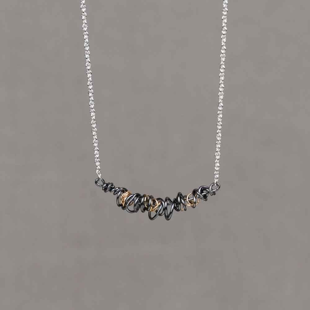 Collier zilver + Twirling oxy + 9 krt